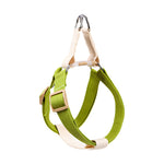 A bright lime green and black mesh pet carrier backpack with a zippered top and side pockets, shown on a plain white background.