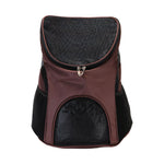 A pet carrier backpack in dark brown and black mesh, shown against a plain white background.